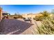 Landscaped backyard with gravel, and two lounge chairs at 8088 W Cinder Brook Way, Florence, AZ 85132