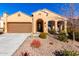 Single-story home with desert landscaping and a two-car garage at 8088 W Cinder Brook Way, Florence, AZ 85132