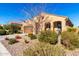 Front view of a single-story house with a desert landscape at 8088 W Cinder Brook Way, Florence, AZ 85132