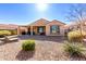 Charming house exterior with a covered patio and desert landscaping at 8088 W Cinder Brook Way, Florence, AZ 85132