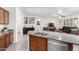 Kitchen island with double sink overlooks living room at 8088 W Cinder Brook Way, Florence, AZ 85132