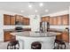 Modern kitchen featuring a large island and granite countertops at 8088 W Cinder Brook Way, Florence, AZ 85132