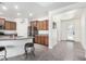 Modern kitchen with wood cabinets and a large island at 8088 W Cinder Brook Way, Florence, AZ 85132