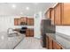 Kitchen with stainless steel appliances and granite countertops at 8088 W Cinder Brook Way, Florence, AZ 85132