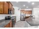 Modern kitchen with stainless steel appliances and granite counters at 8088 W Cinder Brook Way, Florence, AZ 85132