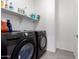 Laundry room with washer, dryer, and shelving at 8088 W Cinder Brook Way, Florence, AZ 85132