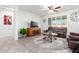 Living room with leather seating and a large TV at 8088 W Cinder Brook Way, Florence, AZ 85132