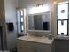 Bathroom with vanity, mirror, and built-in shelving at 8600 E Broadway Rd # 43, Mesa, AZ 85208