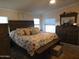 Spacious Primary bedroom with large bed and dresser at 8600 E Broadway Rd # 43, Mesa, AZ 85208