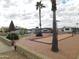 Community bocce ball court with palm trees and landscaping at 8600 E Broadway Rd # 43, Mesa, AZ 85208