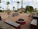 Relaxing community patio with fire pit, benches, and picnic tables at 8600 E Broadway Rd # 43, Mesa, AZ 85208