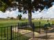 Fenced dog park with grassy area and benches at 8600 E Broadway Rd # 43, Mesa, AZ 85208