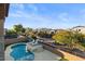 Stunning backyard oasis featuring a sparkling pool, relaxing patio furniture, and serene landscaping at 904 E Hampton Ln, Gilbert, AZ 85295