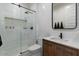 Modern bathroom with a frameless shower and stylish vanity at 904 E Hampton Ln, Gilbert, AZ 85295