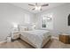 Bright bedroom with a comfortable bed, nightstand, and ample natural light at 904 E Hampton Ln, Gilbert, AZ 85295