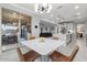 Modern dining area with a white table and four brown chairs at 904 E Hampton Ln, Gilbert, AZ 85295