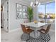 Bright dining area with modern table and chairs, overlooks the pool at 904 E Hampton Ln, Gilbert, AZ 85295