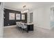 Modern dining room with a sleek dining table and statement lighting at 904 E Hampton Ln, Gilbert, AZ 85295