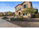 Two-story house with beige exterior and lush landscaping at 904 E Hampton Ln, Gilbert, AZ 85295