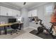 Home office with desk, chair, and Peloton exercise bike at 904 E Hampton Ln, Gilbert, AZ 85295