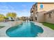 Luxury pool with a waterfall feature and plenty of space for lounging at 904 E Hampton Ln, Gilbert, AZ 85295