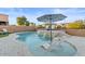 Inviting kidney shaped pool with waterfall feature and lounge chairs at 904 E Hampton Ln, Gilbert, AZ 85295