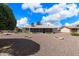 Spacious backyard view with gravel and desert plants at 9838 W Santa Fe Dr, Sun City, AZ 85351