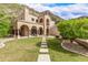 Luxury home with a spacious backyard, stone pathway, and mountain views at 10418 N Central Ave, Phoenix, AZ 85020