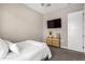 Comfortable bedroom with a dresser and TV at 10488 W Deanna Dr, Peoria, AZ 85382