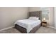 Cozy bedroom with tufted headboard and neutral decor at 10488 W Deanna Dr, Peoria, AZ 85382