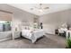 Bright bedroom with carpeted floor and ceiling fan at 10488 W Deanna Dr, Peoria, AZ 85382