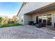 Relaxing covered patio with seating and hot tub, extending living space at 10488 W Deanna Dr, Peoria, AZ 85382