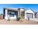 Single-story home with gray exterior, two-car garage, and desert landscaping at 10488 W Deanna Dr, Peoria, AZ 85382