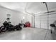Garage with motorcycle and ample storage at 10488 W Deanna Dr, Peoria, AZ 85382