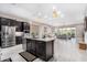 Modern kitchen with island and stainless steel appliances at 10488 W Deanna Dr, Peoria, AZ 85382