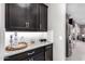 Kitchen features granite countertops and dark wood cabinets at 10488 W Deanna Dr, Peoria, AZ 85382