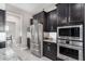 Modern kitchen with stainless steel appliances and granite countertops at 10488 W Deanna Dr, Peoria, AZ 85382