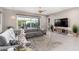 Living room with sectional sofa and backyard access at 10488 W Deanna Dr, Peoria, AZ 85382