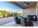 Relaxing covered patio with seating area at 10488 W Deanna Dr, Peoria, AZ 85382