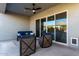 Covered patio with seating and sliding doors at 10488 W Deanna Dr, Peoria, AZ 85382