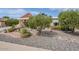 Well maintained front yard with low water landscaping at 10814 W Palmeras Dr, Sun City, AZ 85373