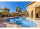 Freeform pool with waterfall feature and ample seating at 11249 E Stradling Ave, Mesa, AZ 85212