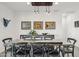 Dining room with rustic table and modern lighting at 12465 E Soloman Rd, Gold Canyon, AZ 85118