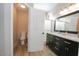 Bathroom with double sinks and separate toilet at 13558 W Saguaro Ln, Surprise, AZ 85374