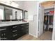 Bathroom with double sinks and walk-in closet at 13558 W Saguaro Ln, Surprise, AZ 85374
