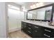 Bathroom with double sinks and marble top at 13558 W Saguaro Ln, Surprise, AZ 85374