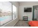 Bedroom with pool view and large window at 13558 W Saguaro Ln, Surprise, AZ 85374