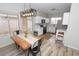 Bright dining room with wood table, metal chairs, and a modern light fixture at 13558 W Saguaro Ln, Surprise, AZ 85374