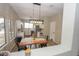 Bright kitchen with an eat-in island and wood dining table at 13558 W Saguaro Ln, Surprise, AZ 85374