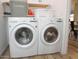 Bright laundry room with LG washer and dryer at 13558 W Saguaro Ln, Surprise, AZ 85374